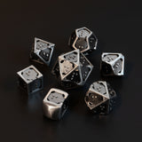 7 piece set of hollow metal braille rpg dice in silver ingot